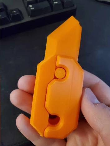 Improved handle for gravity knife fidget toy